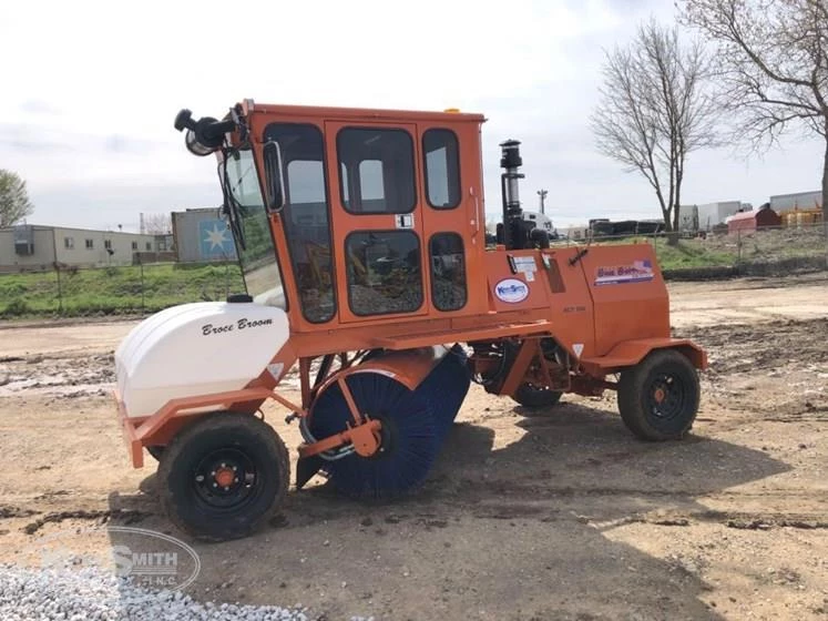 Side of used Broce Broom